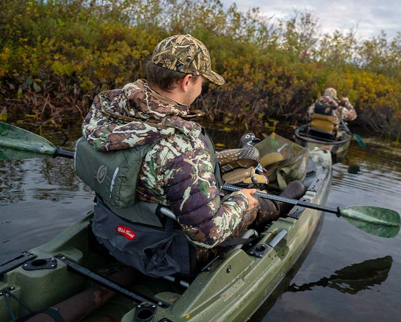 Paddling through narrow hunting spot in Old Town Sportsman BigWater 132 fishing kayak