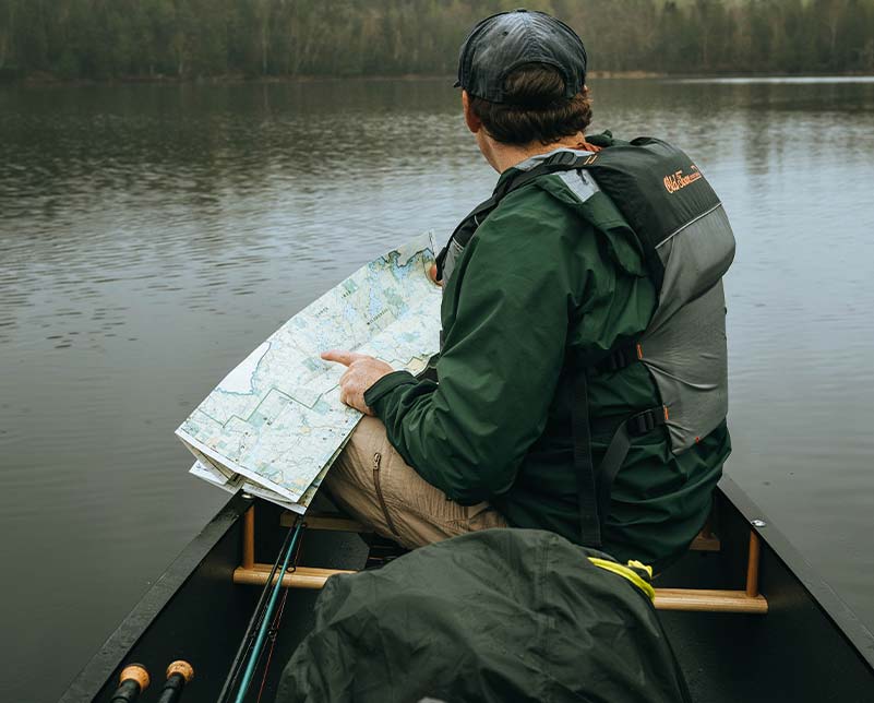 Pointing at map while navigating in the Old Town Penobscot canoe