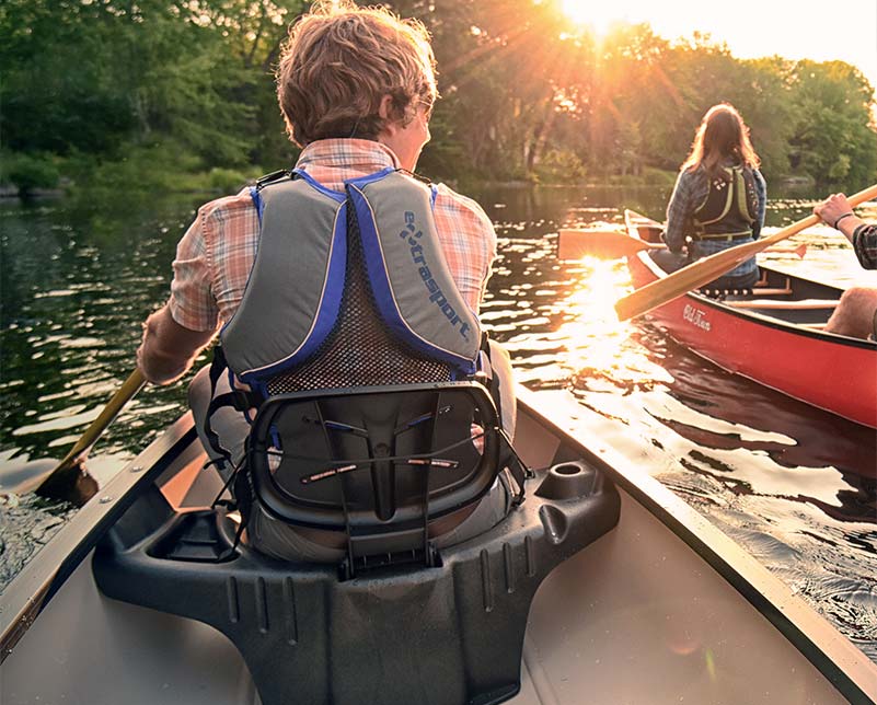 Man paddling in Old Town Saranac canoe